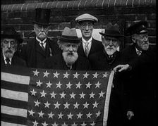 A Group of American Civil War Veterans Stand Together Holding the American Flag, 1924. Creator: British Pathe Ltd