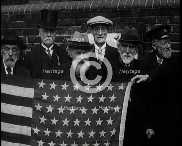 A Group of American Civil War Veterans Stand Together Holding the American Flag, 1924. Creator: British Pathe Ltd.