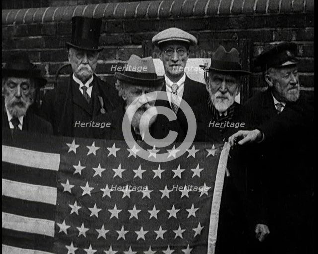 A Group of American Civil War Veterans Stand Together Holding the American Flag, 1924. Creator: British Pathe Ltd.
