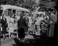 A Group of British Women Dancing On a Grass Verge in the Sunshine With Two Buses Parked..., 1938. Creator: British Pathe Ltd