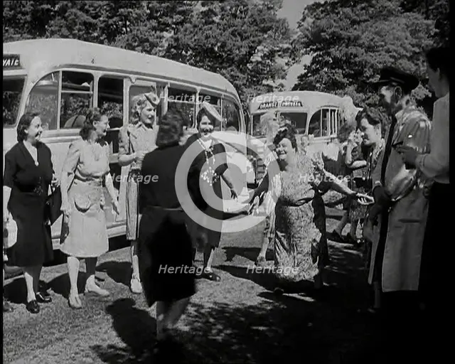 A Group of British Women Dancing On a Grass Verge in the Sunshine With Two Buses Parked..., 1938. Creator: British Pathe Ltd.