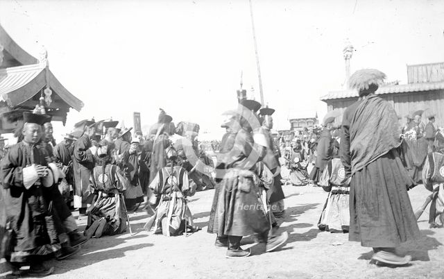 A group of Buddhist monks in the datsan, 1880.  Creator: Nikolai Nikolaevich Petrov.