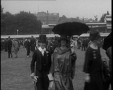 A Group of Civilians Dressed Glamorously Walking on the Grounds of a Cricket Match, 1920. Creator: British Pathe Ltd
