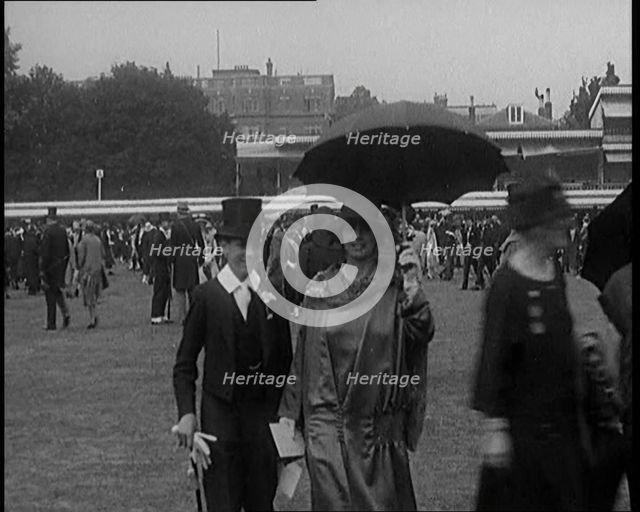 A Group of Civilians Dressed Glamorously Walking on the Grounds of a Cricket Match, 1920. Creator: British Pathe Ltd.