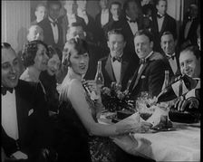 A Group of Fashionable Young People Sitting at a Table Drinking Champagne, 1924. Creator: British Pathe Ltd