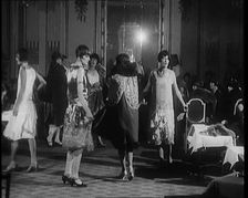 A Group of Female Civilians Modelling Various Glamorous Outfits in a Fashion Parade, 1920. Creator: British Pathe Ltd