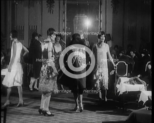 A Group of Female Civilians Modelling Various Glamorous Outfits in a Fashion Parade, 1920. Creator: British Pathe Ltd.