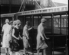 A Group of Female Civilians Board a Carriage of the Never Stop Railway 1924. Creator: British Pathe Ltd