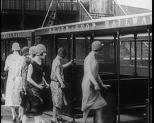 A Group of Female Civilians Board a Carriage of the Never Stop Railway 1924. Creator: British Pathe Ltd