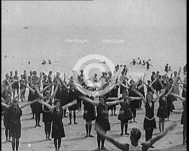 A Group of Female Civilians Exercising on a Beach, 1920. Creator: British Pathe Ltd.