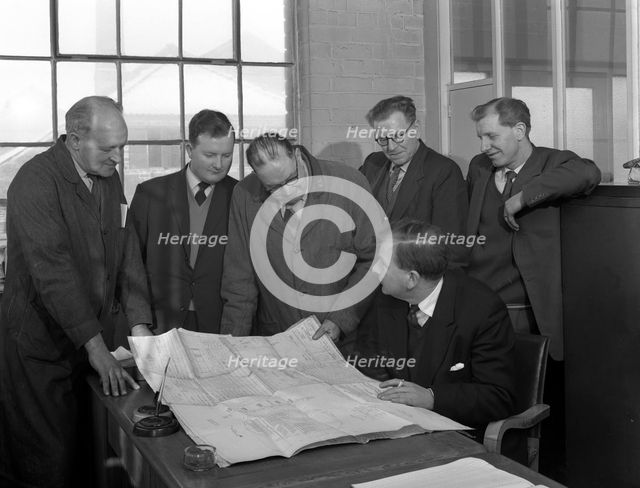 A group of foundry staff with technical drawings, Sheffield, South Yorkshire, 1963. Creator: Michael Walters.