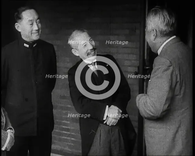 A Group of Four Male Japanese Politicians Talking Animatedly, 1937. Creator: British Pathe Ltd.