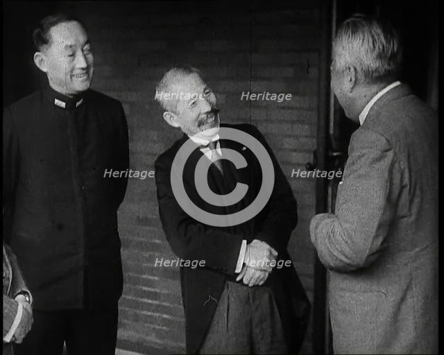 A Group of Four Male Japanese Politicians Talking Animatedly, 1937. Creator: British Pathe Ltd.