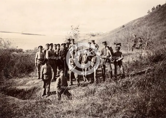 A group of Irkutsk high school students with a teacher on the bank of the river (Ushakovka), 1900. Creators: I. A. Podgorbunskii, V. I. Podgorbunskii.