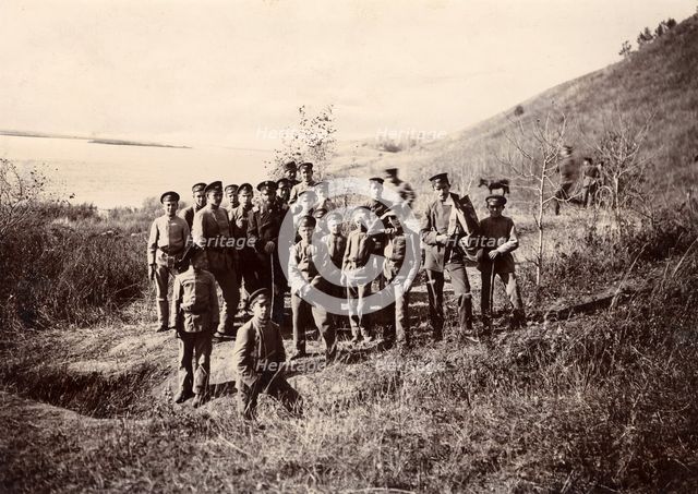 A group of Irkutsk high school students with a teacher on the bank of the river (Ushakovka), 1900. Creators: I. A. Podgorbunskii, V. I. Podgorbunskii.