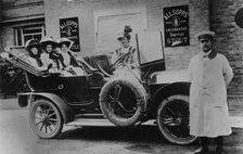 A group of ladies in a car, with their uniformed chauffeur, 1910