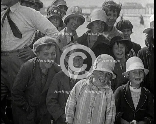 A Group of Male and Female Children Laughing as They Are Watching a Film Being Made, 1920s. Creator: British Pathe Ltd.
