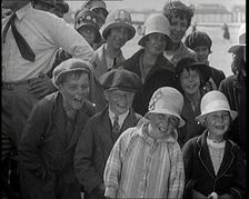 A Group of Male and Female Children Laughing as They Are Watching a Film Being Made, 1920s. Creator: British Pathe Ltd