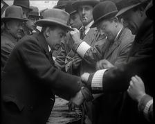 A Group of Male Civilians Volunteers Being Issued With White Arm Bands, 1926. Creator: British Pathe Ltd