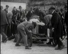A Group of Male Civilians Working on a Car, 1924. Creator: British Pathe Ltd