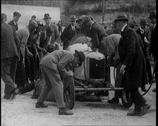 A Group of Male Civilians Working on a Car, 1924. Creator: British Pathe Ltd