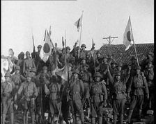 A Group of Male Japanese Soldiers, Many Waving Guns Aloft and Some With Japanese Flags..., 1937. Creator: British Pathe Ltd