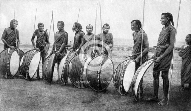 A group of Masai warriors in full battle panoply, 1922.Artist: SJ Hopper