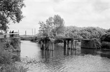 A group of men contemplate a footbridge over the River Medway at Barming, c1945-c1965. Artist: SW Rawlings