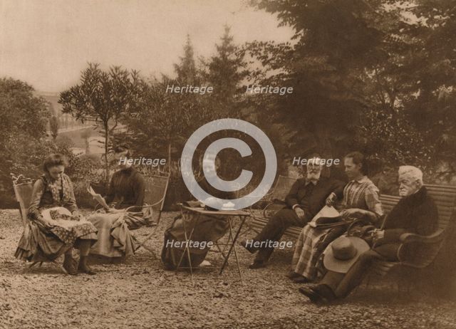 'A group of men and women sat talking by a table', 1937. Artist: Louis Guichard.
