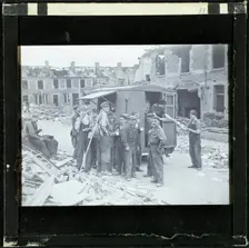 A group of men, possibly rescue workers, outside a tea van on a bomb damaged street, England, 1940-5 Creator: Norman Kingsley Harrison