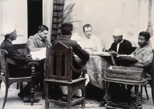 A group of men taking notes at a table, during a plague epidemic in Mandalay, 1906. Creator: Unknown