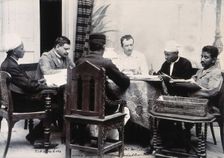 A group of men taking notes at a table, during a plague epidemic in Mandalay, 1906. Creator: Unknown
