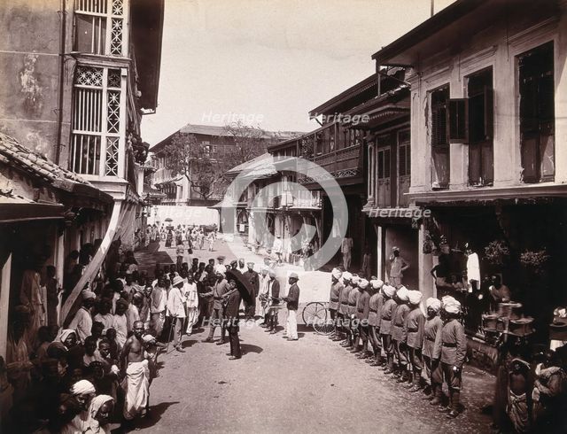 A group of officials making a visit to a house in Bombay, suspected of holding people with..., 1896. Creator: Unknown.