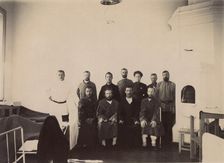 A group of people being treated in a hospital room, 1900. Creators: I. A. Podgorbunskii, V. I. Podgorbunskii