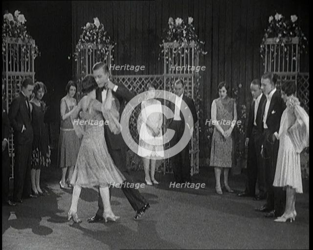 A Group of People Dancing the Charleston. One Female Civilian is Rubbing Her Legs is Pain, 1926. Creator: British Pathe Ltd.
