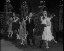 A Group of People Dancing the Charleston. One Female Civilian is Rubbing Her Legs is Pain, 1926. Creator: British Pathe Ltd