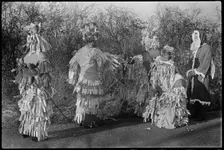 A group of people in costume performing in a Mummers play, Andover, Test Valley, Hampshire, 1948. Creator: George R Long