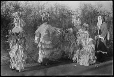 A group of people in costume performing in a Mummers play, Andover, Test Valley, Hampshire, 1948. Creator: George R Long