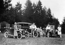 A group of people on an outing with their cars, c1929-c1930