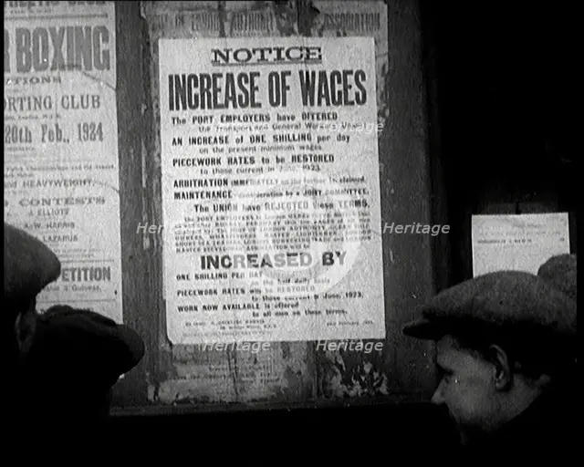 A Group of People Looking at a Sign. the Sign Reads 'Notice Increase of Wages', 1924. Creator: British Pathe Ltd.