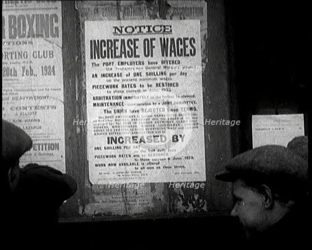 A Group of People Looking at a Sign. the Sign Reads 'Notice Increase of Wages', 1924. Creator: British Pathe Ltd.