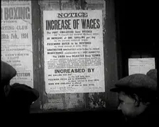 A Group of People Looking at a Sign. the Sign Reads Notice Increase of Wages 1924. Creator: British Pathe Ltd
