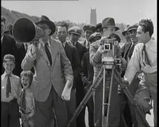 A Group of People Laughing as They Are Watch the Film Being Made from Behind a Camera, 1920s. Creator: British Pathe Ltd