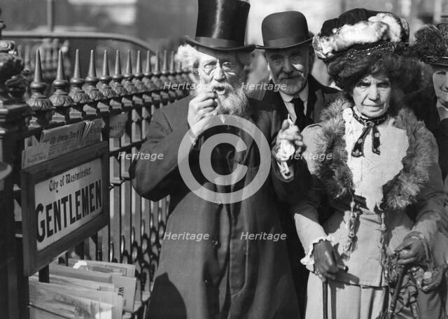 A group of people passing a gents' public toilet, Westminster, London, c1900-1919(?). Artist: Unknown
