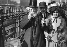 A group of people passing a gents public toilet, Westminster, London, c1900-1919(?)