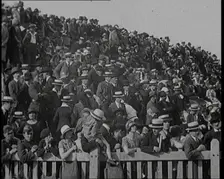 A Group of People Waving As Old Fashioned Looking Hot Air Balloons Are Taking Off the Ground, 1920s. Creator: British Pathe Ltd