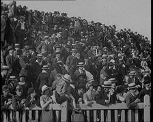 A Group of People Waving As Old Fashioned Looking Hot Air Balloons Are Taking Off the Ground, 1920s. Creator: British Pathe Ltd