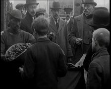 A Group of People Waiting To Receive a Measure of Coal, 1924. Creator: British Pathe Ltd