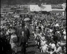 A Group of Politicians Walking Through a Large Crowd of People, 1920s. Creator: British Pathe Ltd