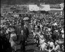 A Group of Politicians Walking Through a Large Crowd of People, 1920s. Creator: British Pathe Ltd